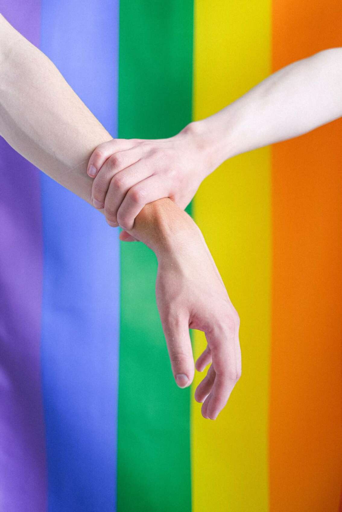 arms-in-front-of-a-gay-pride-flag-4611697